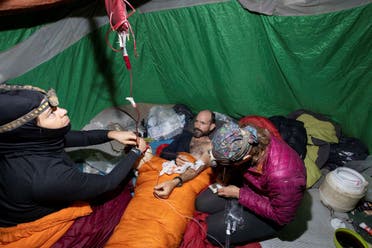 A medical team takes care of American caver Mark Dickey, center, 40, inside the Morca cave near Anamur, southern Turkey, Saturday, Sept. 9, 2023. (AP)