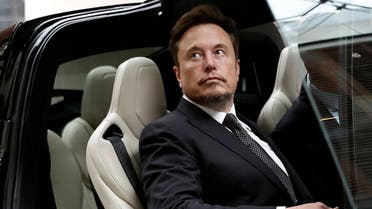 Tesla Chief Executive Officer Elon Musk gets in a Tesla car as he leaves a hotel in Beijing, China May 31, 2023. REUTERS/Tingshu Wang