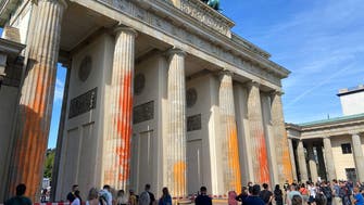 Columns of Berlin’s Brandenburg Gate spray-painted by climate activists