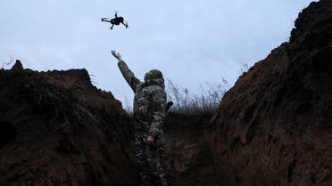 Ghost, 24, a soldier with the 58th Independent Motorized Infantry Brigade of the Ukrainian Army, catches a drone while testing it so it can be used nearby, as Russia's invasion of Ukraine continues, near Bakhmut, Ukraine, November 25, 2022. (File photo: Reuters)
