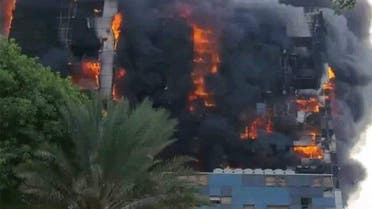 This picture taken on September 17, 2023 shows a raging fire at the Greater Nile Petroleum Oil Company Tower in Khartoum. Battles between the regular army and the paramilitary Rapid Support Forces, which intensified on September 17, had set fire to several key buildings in the centre of Sudan's capital. (Photo by AFP)