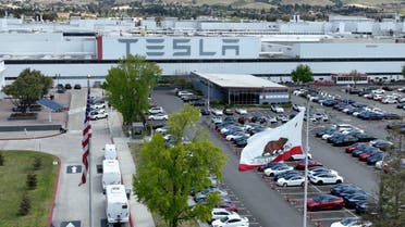 APRIL 20 In an aerial view, a sign is posted on the exterior of the Tesla factory on April 20, 2022 in Fremont, California. (AFP)
