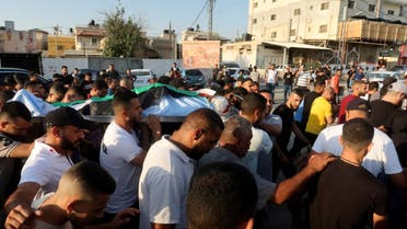 Mourners carry the body of a Palestinian who was killed in an Israeli raid, during his funeral in Jericho in the Israeli-occupied West Bank September 20, 2023. (Reuters)