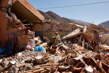 Ait Abdellah Brahim, 86, gestures among rubble, in the aftermath of a deadly earthquake, in Talat N'Yaaqoub, Morocco, September 16, 2023. (Reuters)