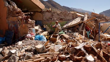 Ait Abdellah Brahim, 86, gestures among rubble, in the aftermath of a deadly earthquake, in Talat N'Yaaqoub, Morocco, September 16, 2023. (Reuters)