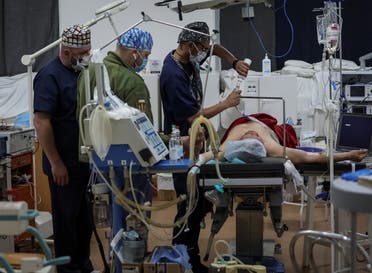 Doctors prepare a wounded Ukrainian soldier for surgery in a hospital, amid Russia's invasion, in Zaporizhzhia, Ukraine May 11, 2022. (Reuters)