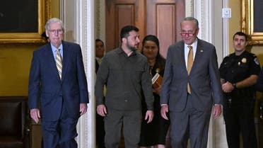 Ukrainian President Volodymyr Zelenskyy (C), accompanied by US Senate Majority Leader Chuck Schumer (2nd R) and Senate Minority Leader Mitch McConnell (L), arrives to meet with US Senators in the Old Senate Chamber, at the US Capitol in Washington, DC, on September 21, 2023. (AFP)