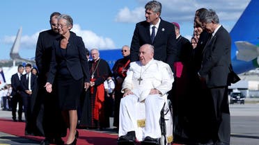 Pope Francis is welcomed by French Prime Minister Elisabeth Borne as he arrives at Marseille Airport on the occasion of the Mediterranean Meetings (MED 2023), in Marignane, France, on September 22, 2023. (Reuters)