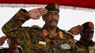 Sudan's General Abdel Fattah al-Burhan salutes as he listens to the national anthem after landing in the military airport of Port Sudan on his first trip away following the crisis in Sudan's capital Khartoum since an internal conflict broke out, in the city of Port Sudan, Sudan, August 27, 2023. REUTERS/Ibrahim Mohammed Ishak