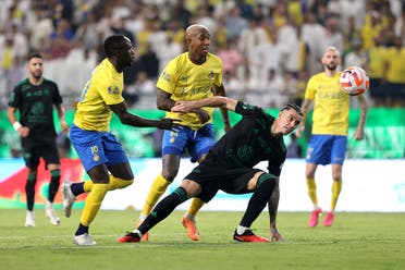 Al Nassr’s Anderson Talisca and Sadio Mane in action with Al Ahli’s Roger Ibanez. (Reuters)