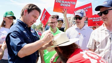 Republican US presidential candidate and Florida Governor Ron DeSantis signs a support-er’s hat, as he campaigns at the Iowa State Fair in Des Moines, Iowa, US, on August 12, 2023. (Reuters)