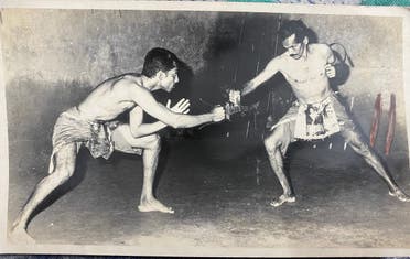 Chirammal Mohammed Sherif (left), in his younger days, honing his weapong fighting skills.  (Supplied)