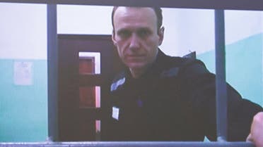 Russian opposition politician Alexei Navalny appears on a screen via video link from the IK-6 penal colony in the Vladimir region, during a court hearing to consider an appeal against his sentence in the criminal case on numerous charges, including the creation of an extremist organization, in Moscow, Russia September 26, 2023. (Reuters)