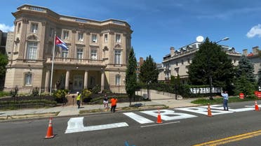 The message Cuba Libre or 'free Cuba', is seen painted in giant block lettering on the street directly in front of the Cuban embassy in this frame grab from video shot in Washington, U.S., July 16, 2021. (Reuters)