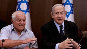 Israeli Prime Minister Benjamin Netanyahu (R) chairs a cabinet meeting, flanked by Tourism Minister Haim Katz, in Jerusalem on August 27, 2023. (Reuters)
