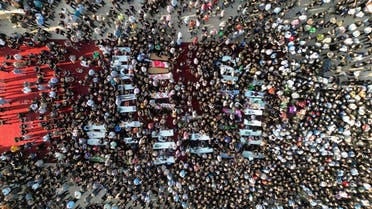 People attend the funeral of victims of the fatal fire of a wedding celebration, in Hamdanya, Iraq, September 27, 2023. (Reuters)
