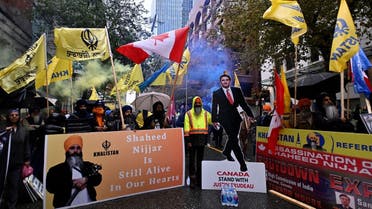 Flags and signs are seen as demonstrators protest outside India’s consulate, a week after Canada’s Prime Minister Justin Trudeau raised the prospect of New Delhi's involvement in the murder of Sikh separatist leader Hardeep Singh Nijjar, in Vancouver, British Columbia, Canada, on September 25, 2023. (Reuters)