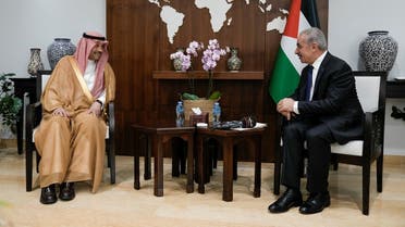Nayef al-Sudairi, Saudi Arabia’s first-ever Saudi ambassador to the Palestinian Authority, left, speaks with Palestinian Prime Minister Mohammad Shtayyeh, during their meeting in the West Bank city of Ramallah, on September 27, 2023. (Reuters)