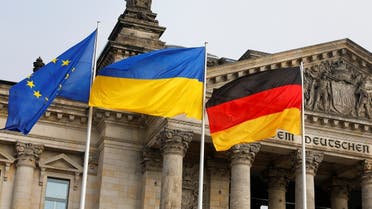 Ukrainian, German and the European Union flags flutter during an anti-war protest, after Russia launched a massive military operation against Ukraine, in Berlin, Germany, February 27, 2022. (Reuters)
