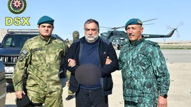 Ruben Vardanyan, a former top official in the separatist ethnic Armenian administration of Nagorno-Karabakh, is seen detained by Azerbaijan's border service personnel in unidentified location, Azerbaijan, in this picture released September 27, 2023. State Border Service of Azerbaijan/Handout via REUTERS ATTENTION EDITORS - THIS IMAGE WAS PROVIDED BY A THIRD PARTY. IMAGE BLURRED AT SOURCE. NO RESALES. NO ARCHIVES. MANDATORY CREDIT