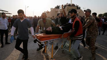 A person is transported on a gurney, during the funeral of victims of the fatal fire of a wedding celebration, in Hamdanya, Iraq, September 27, 2023. (Reuters))