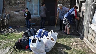 A family consisted of Nataliia, 61, her husband Serhii, 67, her daughter Svitlana, 36, and her grandson Dmytro, 10, prepare to evacuate from their house in a village near the front line, amid Russia’s attack on Ukraine, in the village of Stepnohirsk in Zaporizhzhia region, Ukraine, September 12, 2023. (Reuters)
