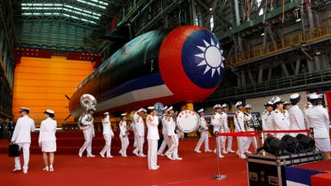 Members of the navy band walk past Haikun, Taiwan's first domestically built submarine, after its launching ceremony in Kaohsiung, Taiwan September 28, 2023. (Reuters)