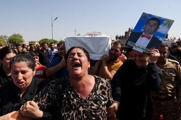 من تشييع ضحايا عرس الحمدانية في العراق (رويترز)