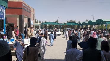 People gather outside the Mastung hospital, following a deadly suicide attack on a religious gathering in Balochistan province, Pakistan, on September 29, 2023 in this handout image. (Reuters)