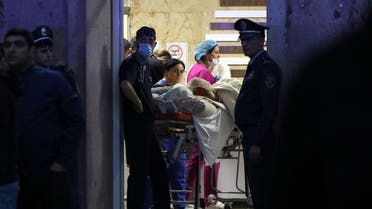 Medics assist a person injured in an explosion at a fuel depot near Stepanakert in the Nagorno-Karabakh region, at the National Burn Center in Yerevan, Armenia, on September 26, 2023. (Reuters)