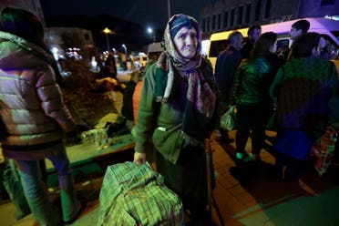An ethnic Armenian woman from Nagorno-Karabakh carries her suitcase to a tent camp after arriving to Armenia’s Goris in Syunik region, Armenia on September 29, 2023. (AP)