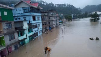 Floodwaters kill at least 31 in India's Sikkim state after lake bursts through dam