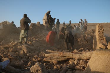 Afghan residents clear debris from a damaged house after an earthquake in Sarbuland village of Zendeh Jan district of Herat province on October 7, 2023. (AFP)