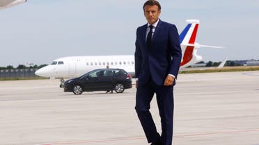 French President Emmanuel Macron arrives to deliver a statement on the tarmac in front of his presidential plane before his departure to visit French NATO troops stationed in Romania, at Paris-Orly Airport in Orly, France, June 14, 2022. REUTERS/Gonzalo Fuentes/Pool