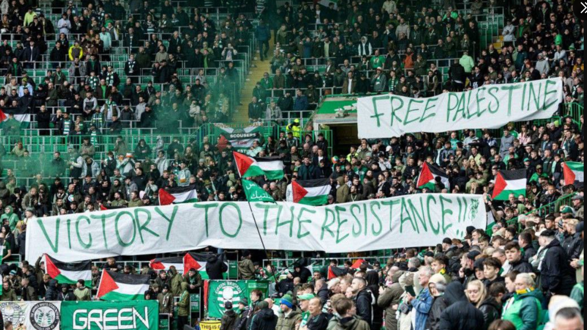 Celtic football club fans wave Palestinian flags in show of