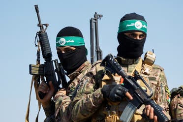 Palestinian fighters from the armed wing of Hamas take part in a military parade near the border in the central Gaza Strip, July 19, 2023. (File photo: Reuters)