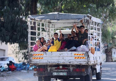 Palestinians flee their houses heading toward the southern part of Gaza Strip after Israel’s call for more than 1 million civilians in northern Gaza to move south within 24 hours, amid the Israeli-Palestinian conflict in Gaza City on October 13, 2023. (Reuters)