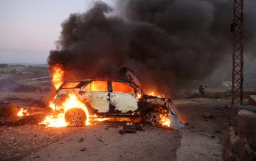 A journalist’s car burns at the site where Reuters vide journalist Issam Abdallah was killed and six others were injured when missiles fired from the direction of Israel struck them, in Alma Al-Shaab, near the border with Israel, southern Lebanon, on October 13, 2023. (Reuters)