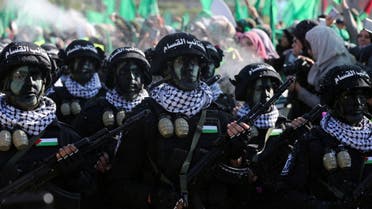 Members of Al Qassam Brigades choir attend a rally marking the 35th anniversary of the Hamas movement’s founding, in Gaza City, December 14, 2022. (Reuters)