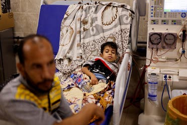 A Palestinian kidney patient lies on a hospital bed, as health officials say they are running out of fuel to operate dialysis devices, amid the ongoing Israeli-Palestinian conflict, at Naser hospital in Khan Younis in the southern Gaza Strip on October 15, 2023. (Reuters)