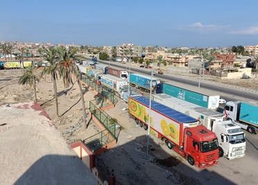 A view of trucks carrying humanitarian aid for Palestinians, as they wait for the re-opening of the Rafah border crossing to enter Gaza, in the city of Al-Arish, Sinai peninsula, Egypt, October 16, 2023. (Reuters)