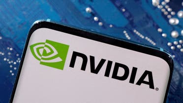A smartphone with a displayed NVIDIA logo is placed on a computer motherboard in this illustration. (Reuters)