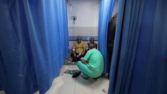 Surgeons operate in corridors as bodies line the walls of overwhelmed Gaza hospitals