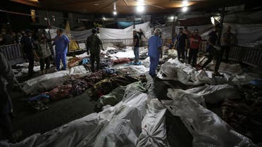Bodies of Palestinians killed by an explosion at the Ahli Arab hospital are gathered in the front yard of the al-Shifa hospital, in Gaza City, central Gaza Strip, Tuesday, Oct. 17, 2023. (AP)
