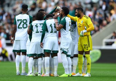 Saudi Arabia team huddle before the match September 12, 2023. (Reuters)