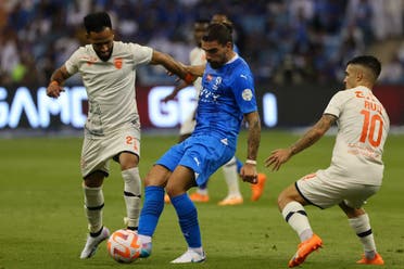 Hilal's Portuguese midfielder #08 Ruben Neves fights for the ball during the Saudi Pro League football match between Al-Hilal and Al-Feiha at the Prince Faisal bin Fahd Stadium in Riyadh on August 19, 2023. (AFP)