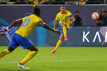 Al Nassr's Portuguese forward #07 Cristiano Ronaldo kicks the ball during the Saudi Pro League football match between Al-Nassr and Al-Taawoun at King Saud University Stadium in Riyadh on August 18, 2023. (AFP)