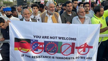 Libyans wave the Palestinian flag during a gathering in Tripoli on October 20, 2023 in support of Palestinians in the Gaza Strip amid the ongoing battles between Israel and the Palestinian group Hamas. (AFP)