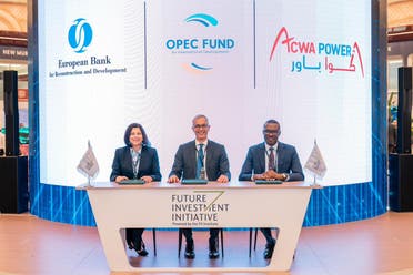 The CEO of the Saudi-based ACWA Power energy and desalination company Marco Arcelli signs an agreement at the Future Investment Initative in Riyadh on October 26, 2023. (Supplied)