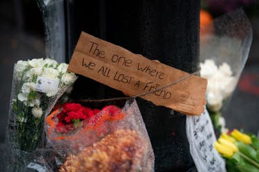 Floral tributes are left for actor Matthew Perry outside the apartment building which was used as the exterior shot in the TV show Friends in New York on October 29, 2023. (AFP)